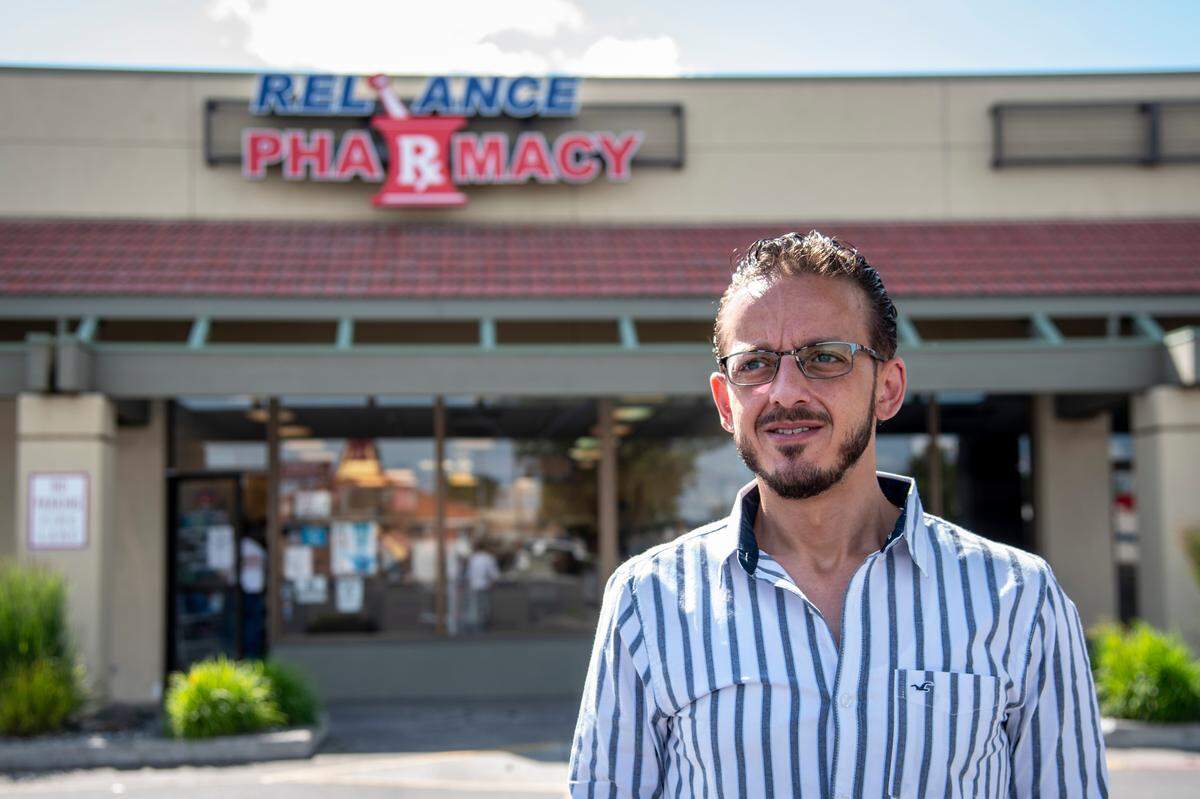 Tamer Elsammak, a pharmacist and president of the Islamic Center of Tri-Cities, stands outside of his pharmacy in Kennewick. “We have to be at work,” he said. “It’s not really an option for pharmacy and so I have to make sure I do as much as I can to minimize risk for coworkers and employees,”