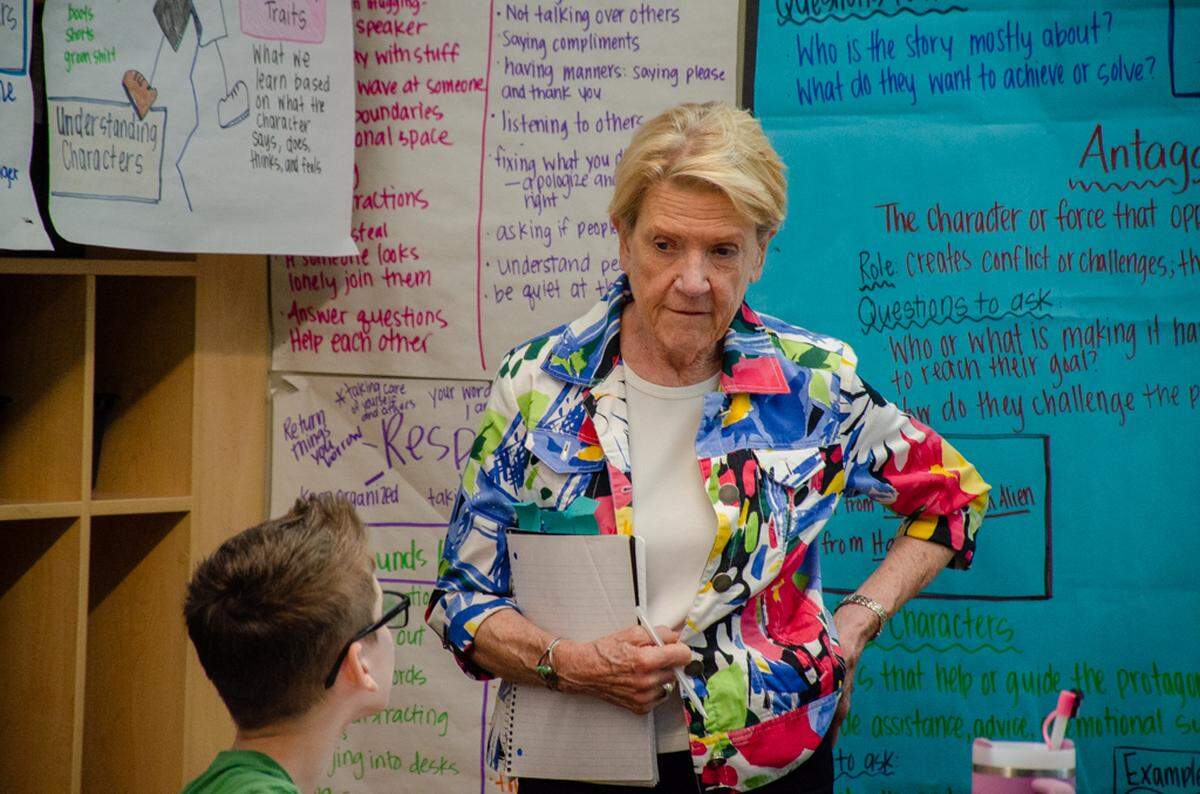 A 5th-grade student from Three Rivers Elementary School in Pasco speaks to Jody Hess, program supervisor for the Highly Capable Student Program at Washington Office of Superintendent of Public Instruction during a school visit Friday, April 25.