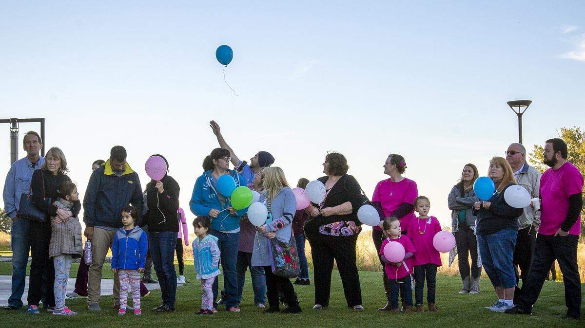 Families gather outside of the Reach museum in Richland on Thursday for Chaplaincy Grief Care’s remembrance event for pregnancy and infant loss. Each family released a balloon to honor a lost child. The event was hosted by the Gone Too Soon support group. October is infant loss remembrance month.