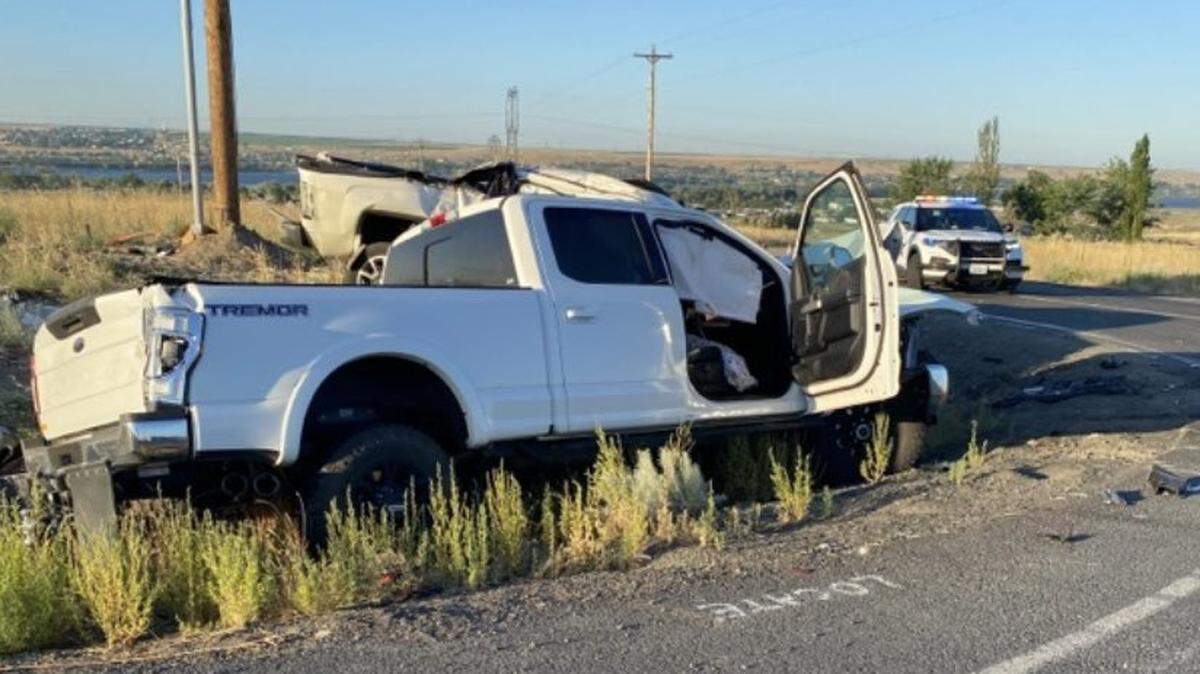 A 35-year-old woman is dead and five others were hurt when a pickup ran a stop sign in southern Benton County early Friday.