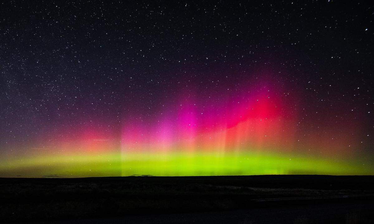 Sarah Kogler, of Seattle, drove to just north of Moses Lake on Wednesday night to capture these colorful photos of the Northern Lights as they made an appearance in Washington.