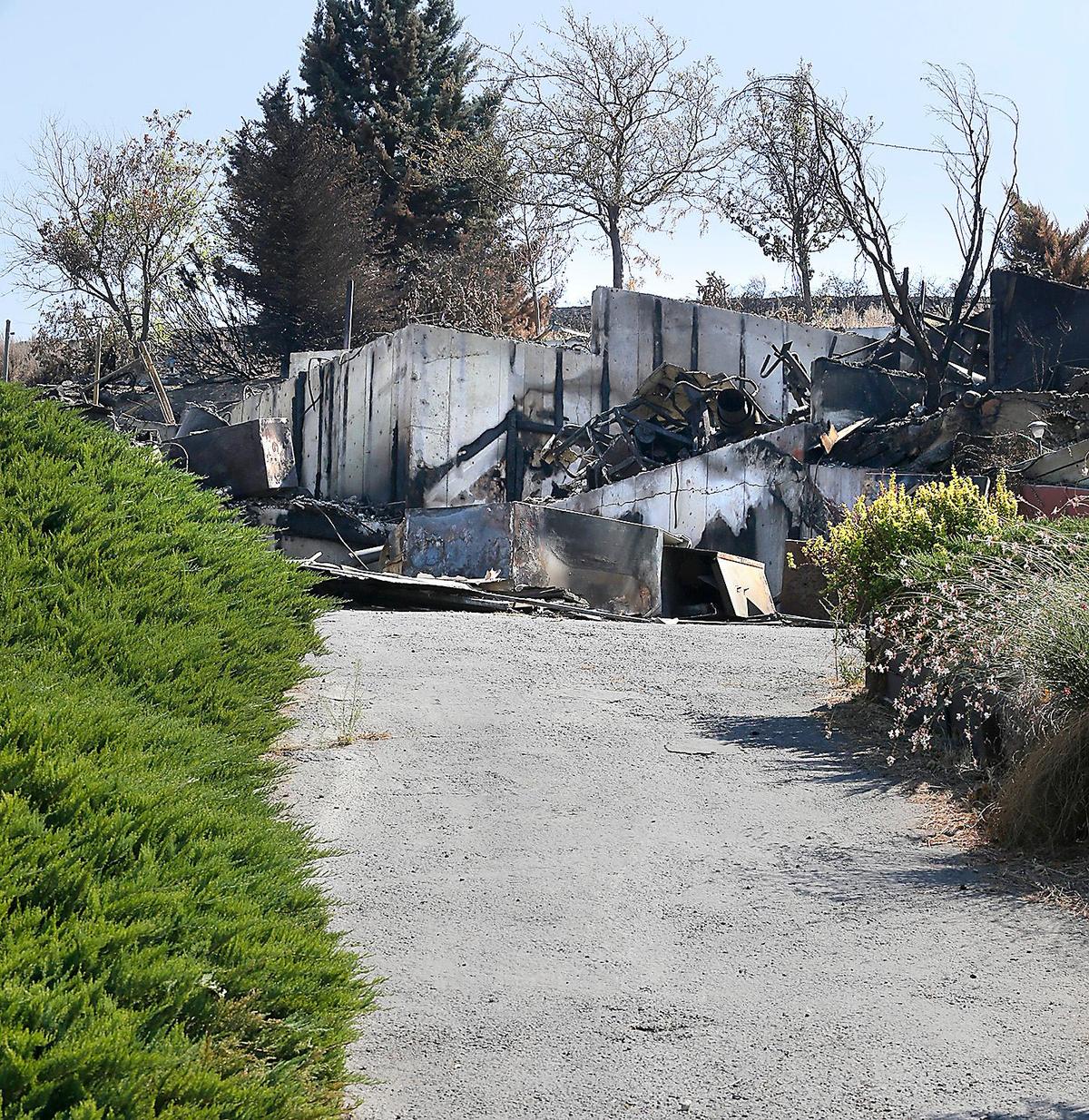 The Miller home at 3403 W. 47th Ave. in Kennewick after the Bofer Canyon brush fire in Kennewick.