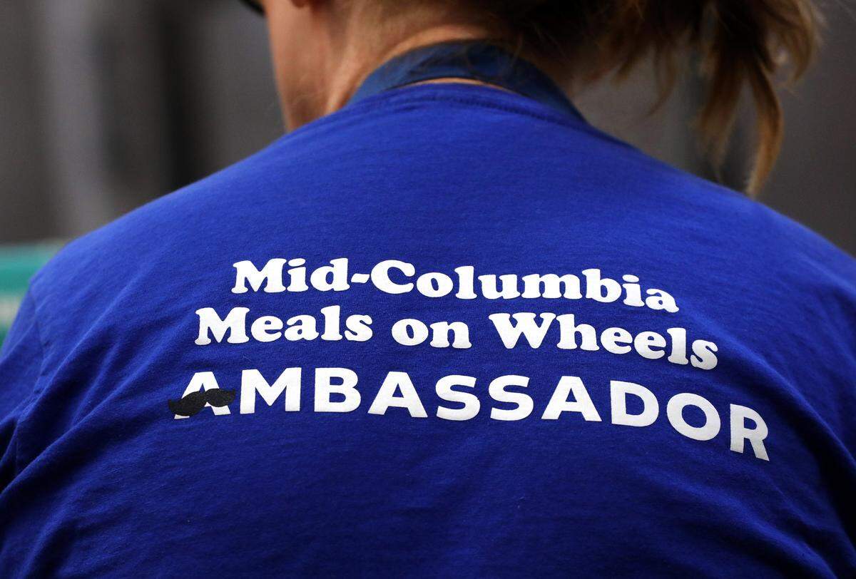 Volunteer Josie Beach wears a volunteering T-shirt for the Mid-Columbia Meals on Wheels program.
