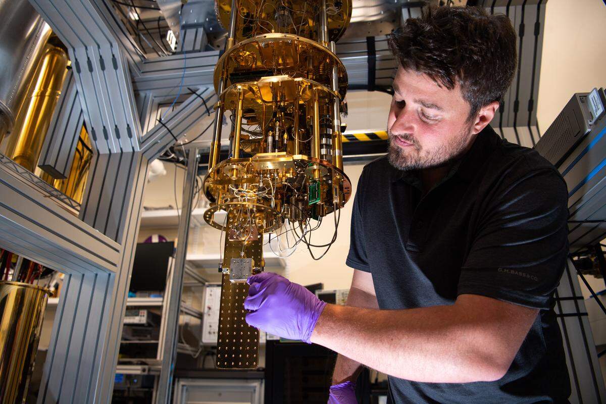 Researchers, including physicist Christian Boutan, are advancing quantum computing by leveraging PNNL capabilities in radiofrequency detection, dark matter detection and quantum information sciences to develop a testbed for experimental semiconductor qubits.