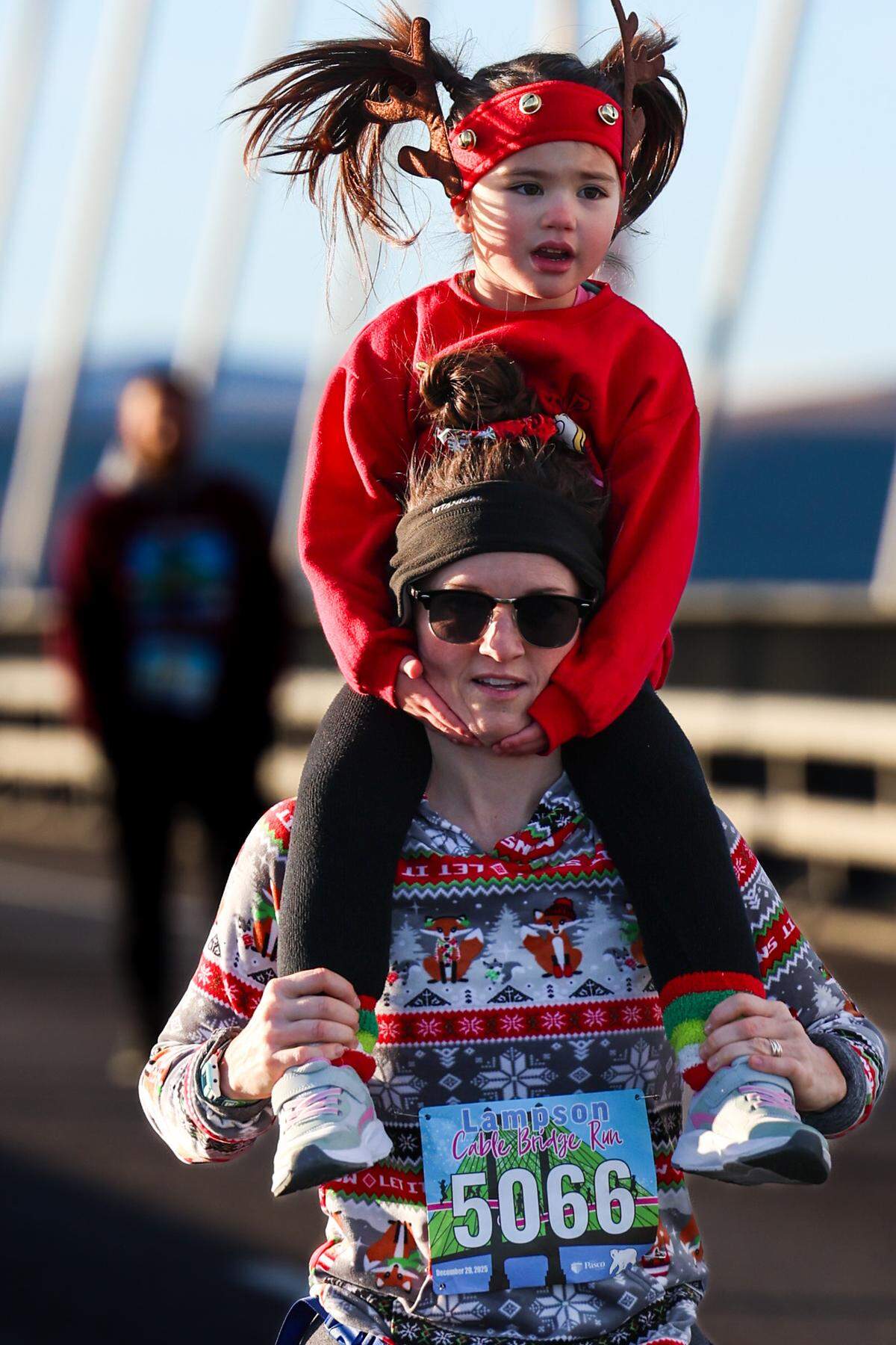 An estimated 2,300 runners and walkers hit the pavement Saturday morning for the 47th annual Lampson Cable Bridge Run in the Tri-Cities.