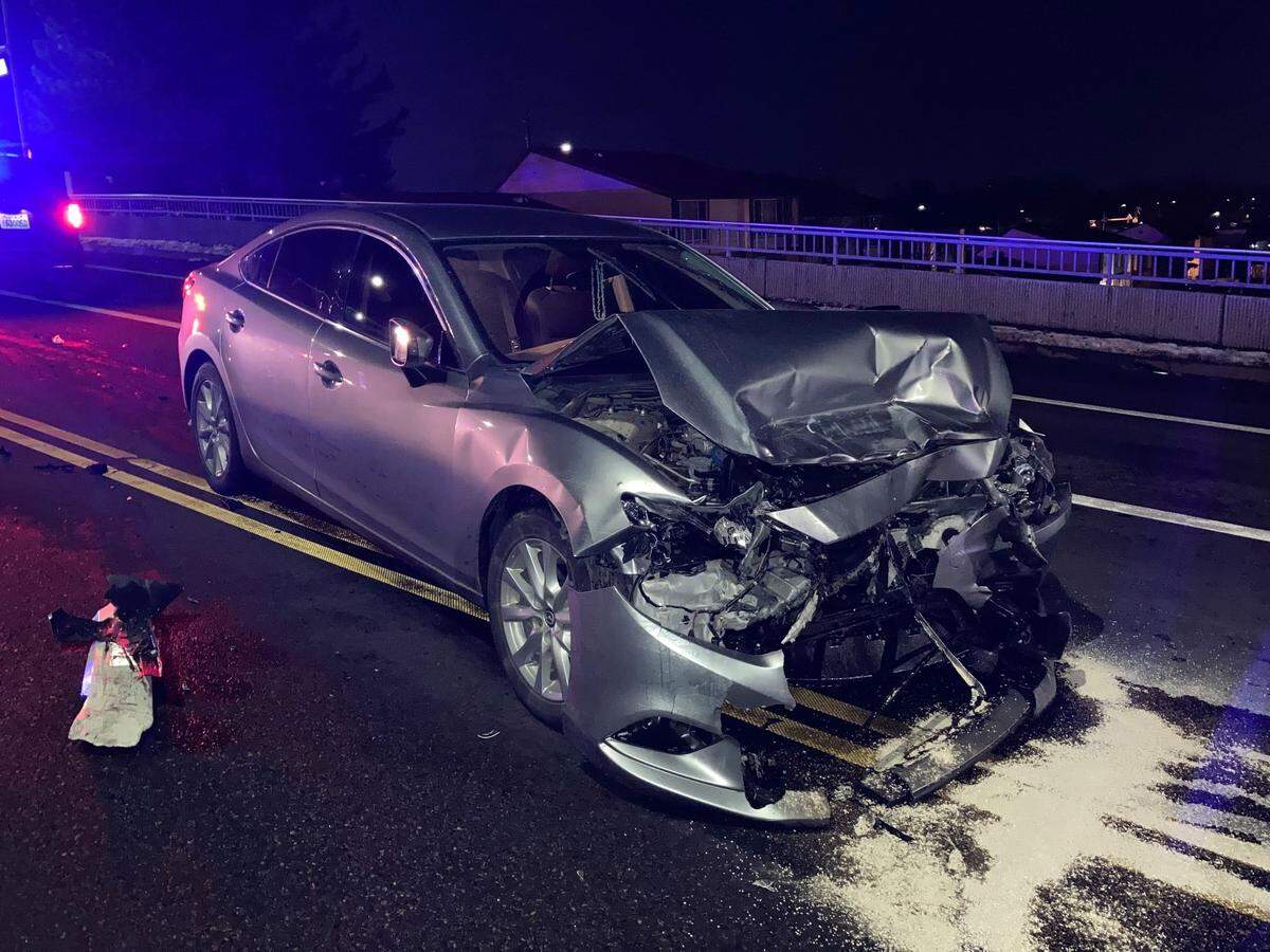 A stolen van ran a red light Saturday evening on West 10th Avenue in Kennewick, causing a crash that damaged this car, three others and the van.
