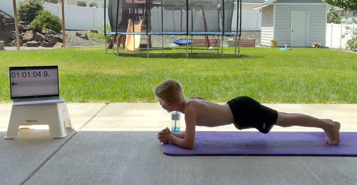 Jack Sims, 9, of Kennewick, set a world record for the longest plank for his age for the Kid’s World Record Book.