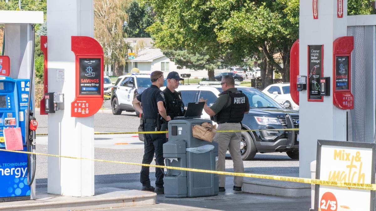Police gather to investigate a shooting incident at the Circle K at Columbia Center Boulevard and West Deschutes Avenue in Kennewick.