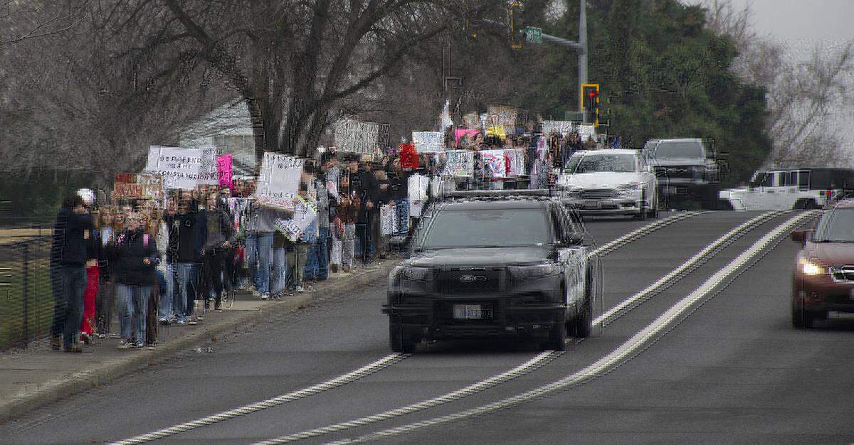Students from Richland High School participate in Friday's walkouts and marches on public sidewalks to protest federal ICE immigration enforcement. They walked from the school to John Dam Plaza.