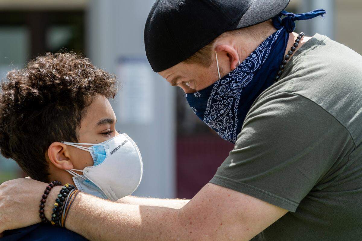 Ryan Mayfield, 43, speaks with his son, Zion, 11, after demonstrators knelt or lied down for eight minutes and 46 seconds to honor George Floyd during a peaceful protest in Pasco on Saturday. “He was upset because he knows what’s going on but he’s only 11 so to see the social justice and the things that are going on around can be confusing for a child, especially a child that has an African-American mother and a white father,” Ryan said.