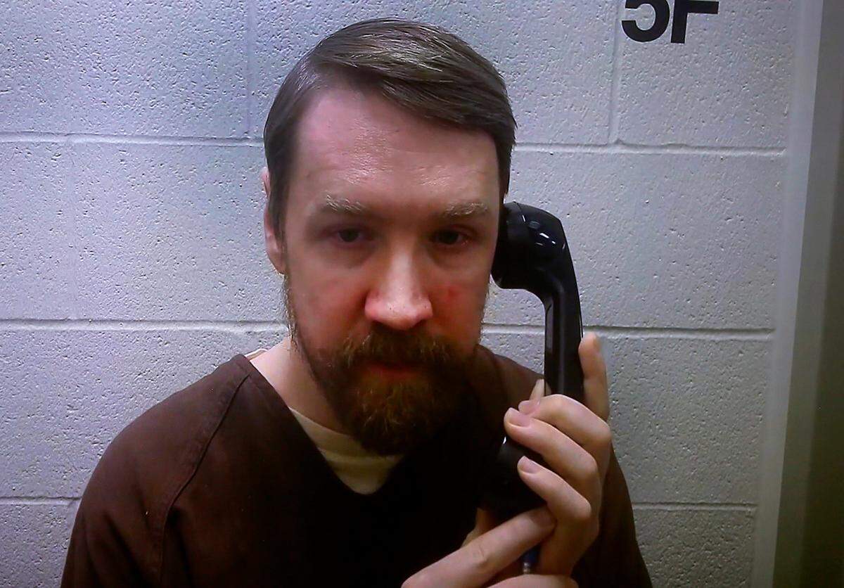 Aaron Christopher Kelly, the suspected gunman in the February 2022 Richland Fred Meyer shooting, appears via video in Benton County Superior Court for a preliminary hearing.