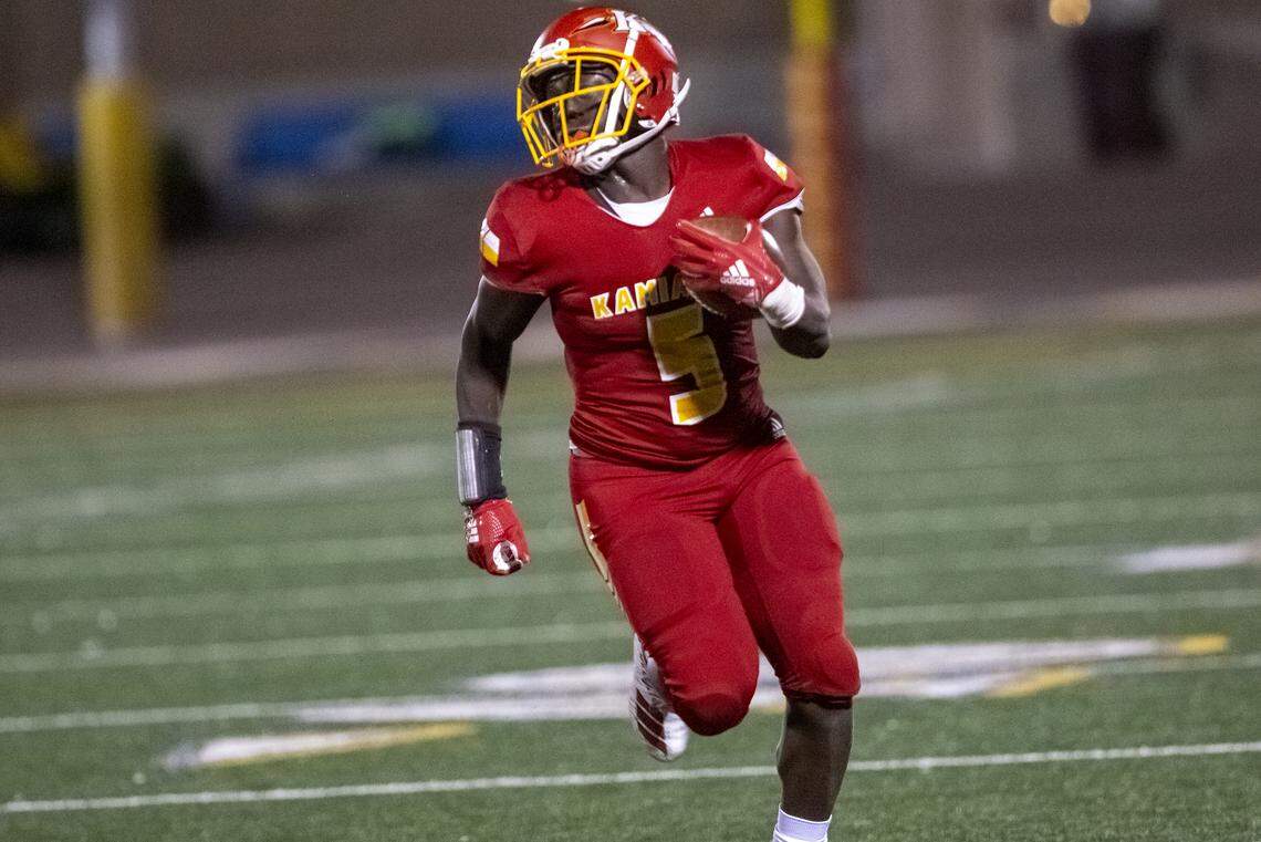 Kamiakin’s runningback Tuna Altahir runs with the ball during a Mid-Columbia Confrence high school football game against Pasco at Lampson Stadium in Kennewick on Friday. Kamiakin defeated Pasco 43 - 25.