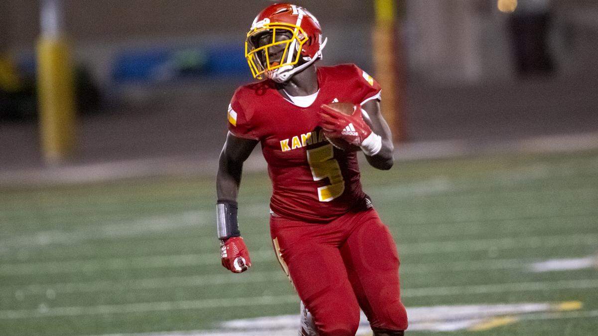 Kamiakin’s runningback Tuna Altahir joined teammates Woodley Downard and Messiah Jones in signing with Eastern Washington University’s football team for next fall.