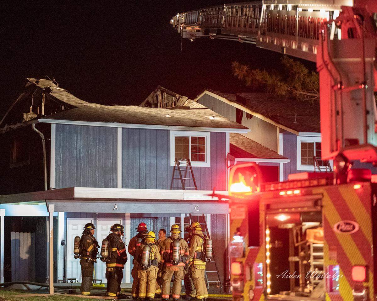 An early Sunday morning wind-driven fire spread from one fourplex to another on the 4200 block of West Albany Street in Kennewick. About 10 people were left without a home.