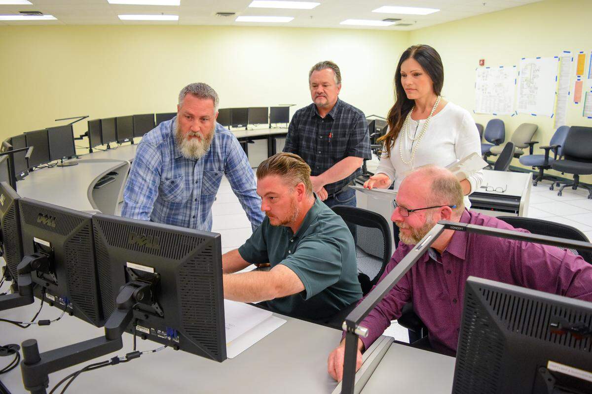 Training manager Heidi Schuette works with new commissioning technicians and the staff of a facility in north Richland used to train workers to operate the the Low Activity Waste Facility at the Hanford nuclear reservation.