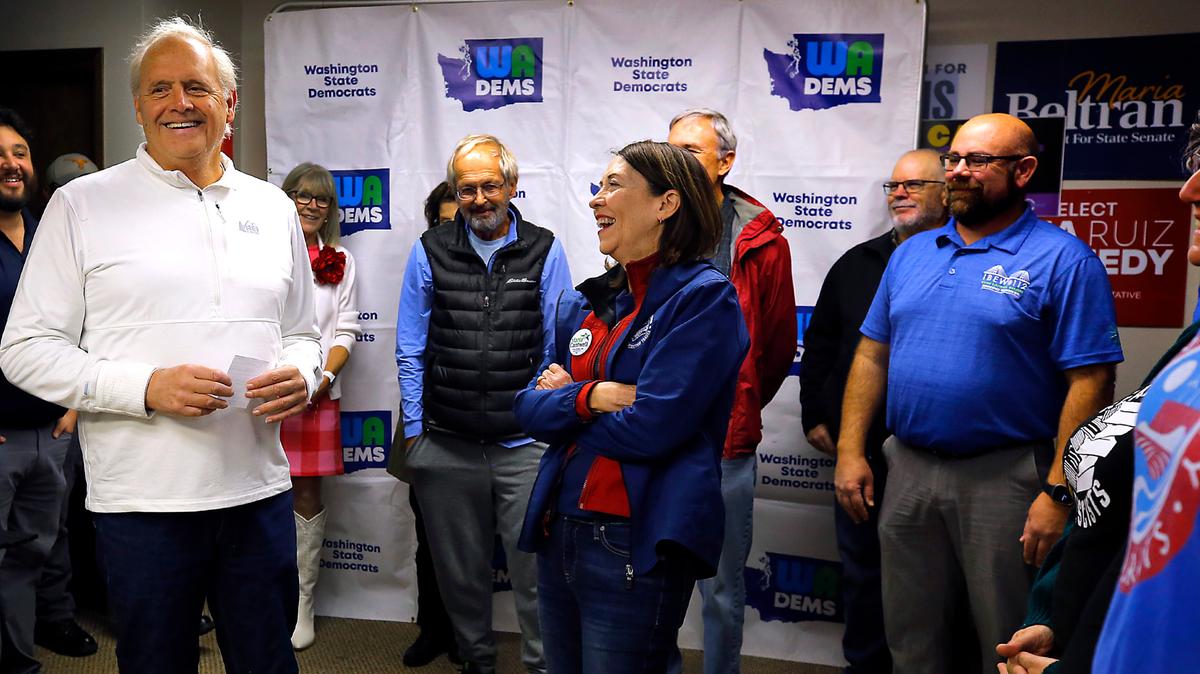 Andy Miller, retired Benton County prosecutor, left, shares a light moment with U.S. Sen. Maria Cantwell, D-Wash. while emceeing Friday’s Get Out The Vote Rally held by the Washington Democrats in Richland.