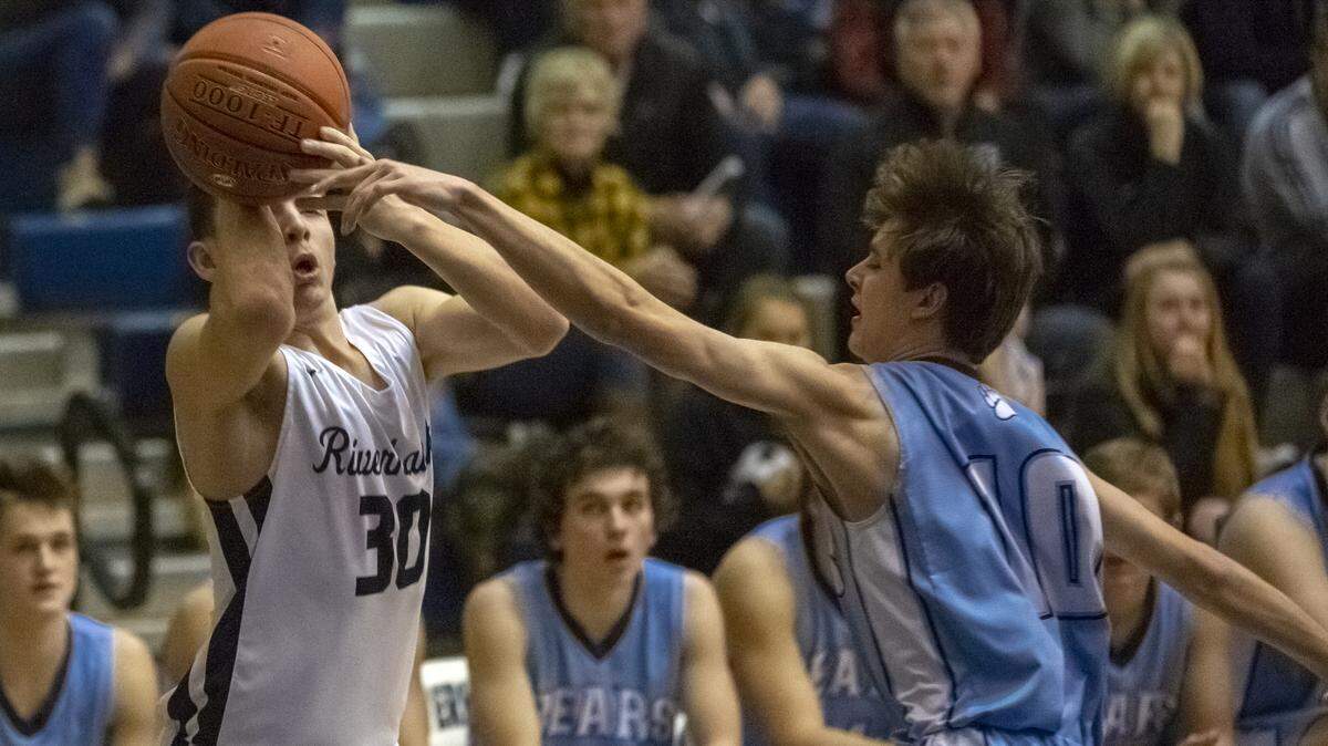 Chiawana’s Connor Mendez (30) takes a shot as Central Valley’s Luke Sukut (10) guards him during a 2019 District 8 4A playoff game.