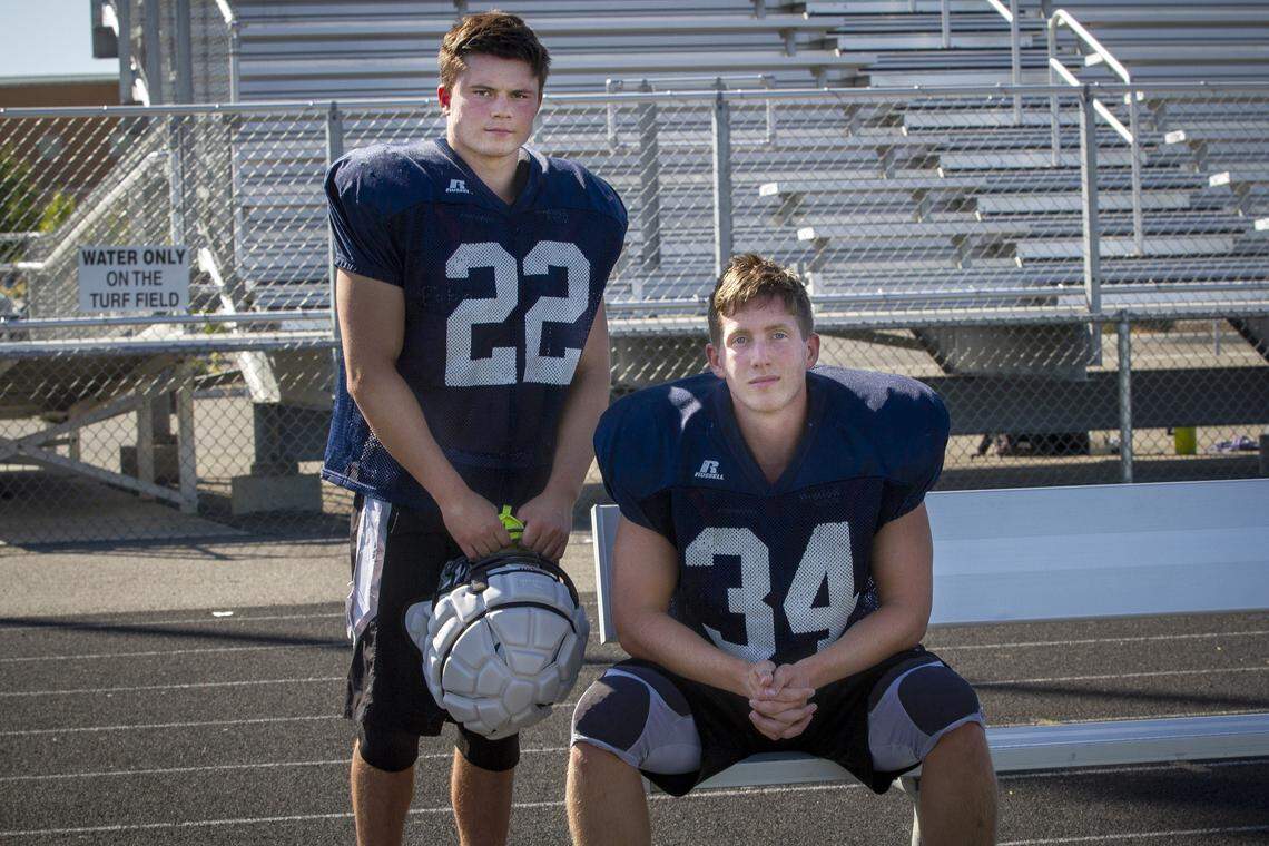 Chiawana’s Riley Cissne (22), left, and Gabe Schilz, (34).