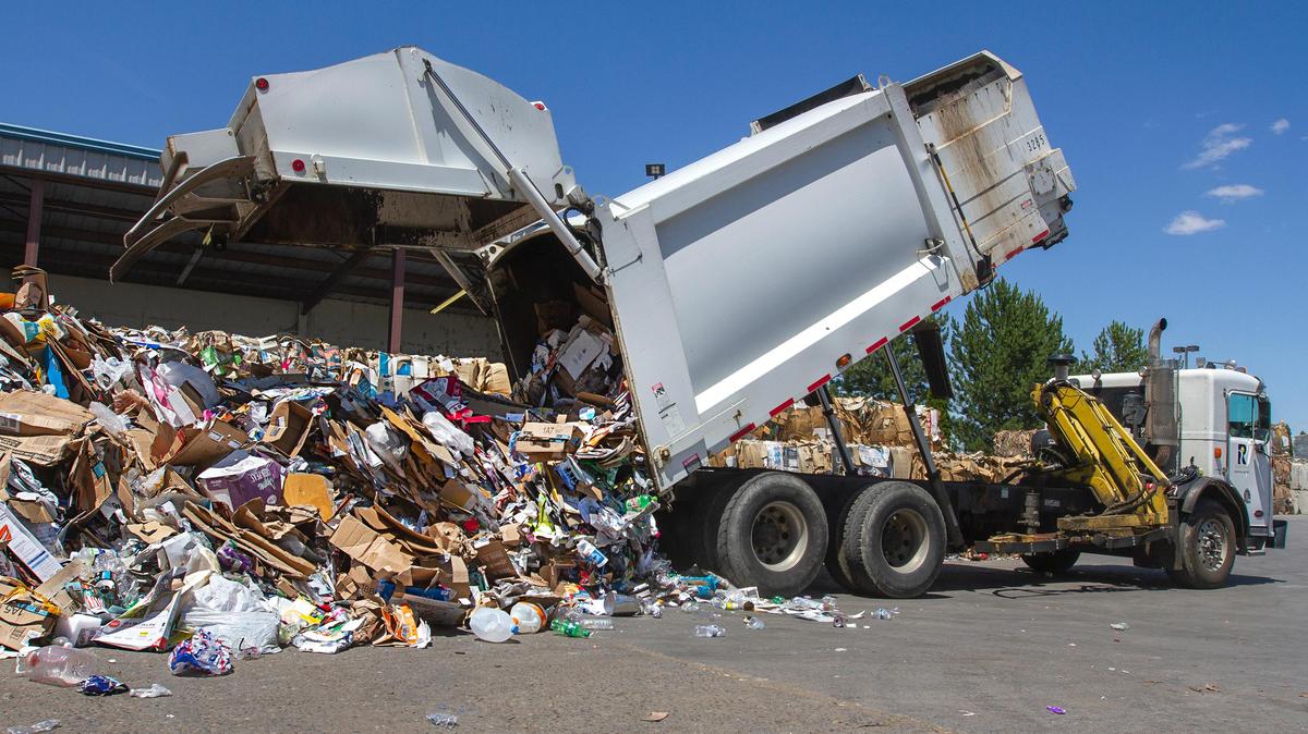 A City of Richland recycling truck dumps out all the recycleables collected from around the city at Clayton-Ward Recycling Center in Richland on Thursday.