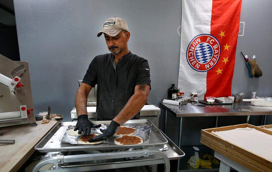 Al-Hayyawi Adnan Hussein, owner of Somer Bakery, prepares Lahm Bi Ajeen for baking in his recently opened business at 5601 W. Clearwater Ave. in Kennewick. The dish, which literally translates to “meat on dough”, is a classic Iraqi dish he described as an Iraqi pizza.