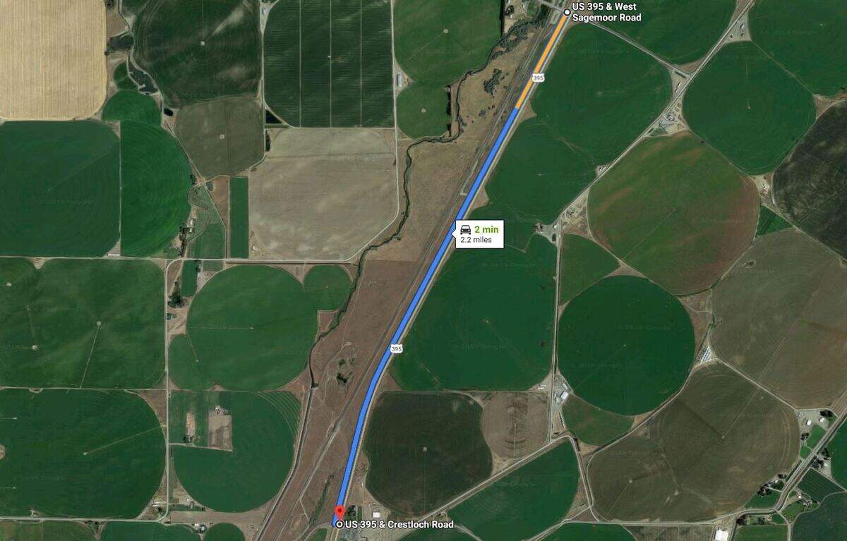 Traffic is blocked off after a truck flipped on Highway 395 and a person was killed.