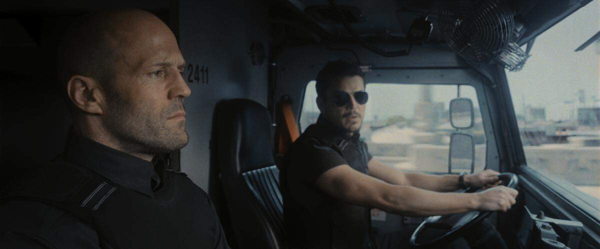 Jason Statham stars as H and Josh Hartnett stars as Boy Sweat Dave in director Guy Ritchie’s “Wrath of Man.”