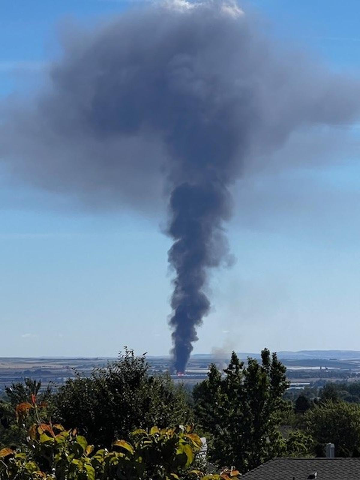A plume of smoke can be seen across the Tri-Cities after a pallet company caught fire in Pasco.