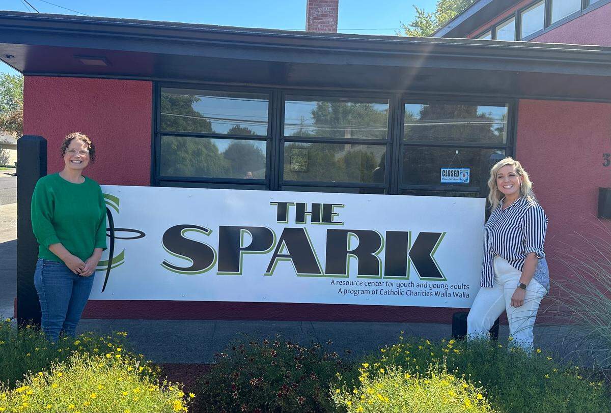 Heidi Meliah, left, and Ruthell Martinez stand outside The Spark, a new Catholic Charities Walla Walla supportive services initiative for youth at risk of becoming unhoused.