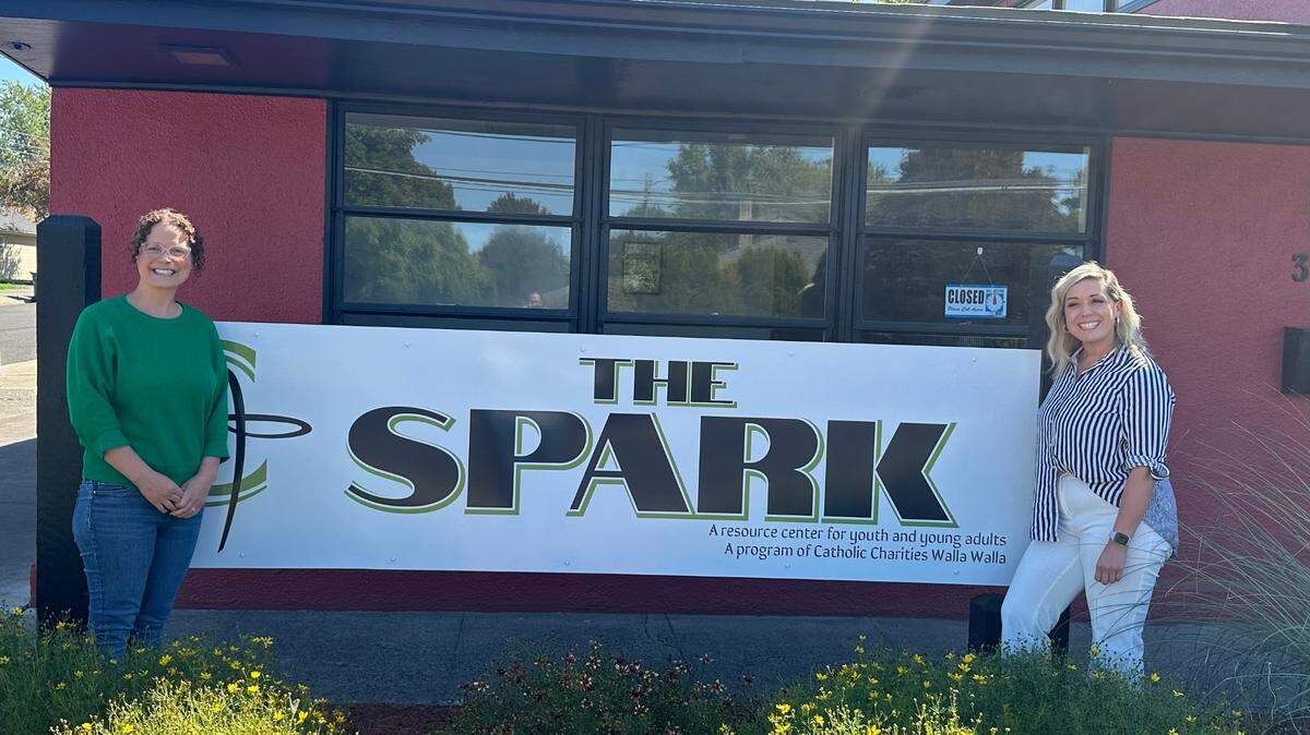 Heidi Meliah, left, and Ruthell Martinez stand outside The Spark, a new Catholic Charities Walla Walla supportive services initiative for youth at risk of becoming unhoused.