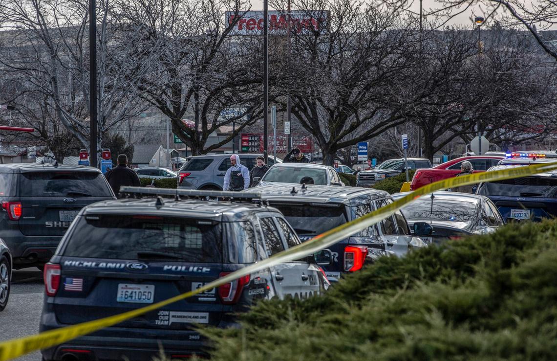 The Fred Meyer parking lot in Richland is blocked off while police investigate a shooting inside the store.