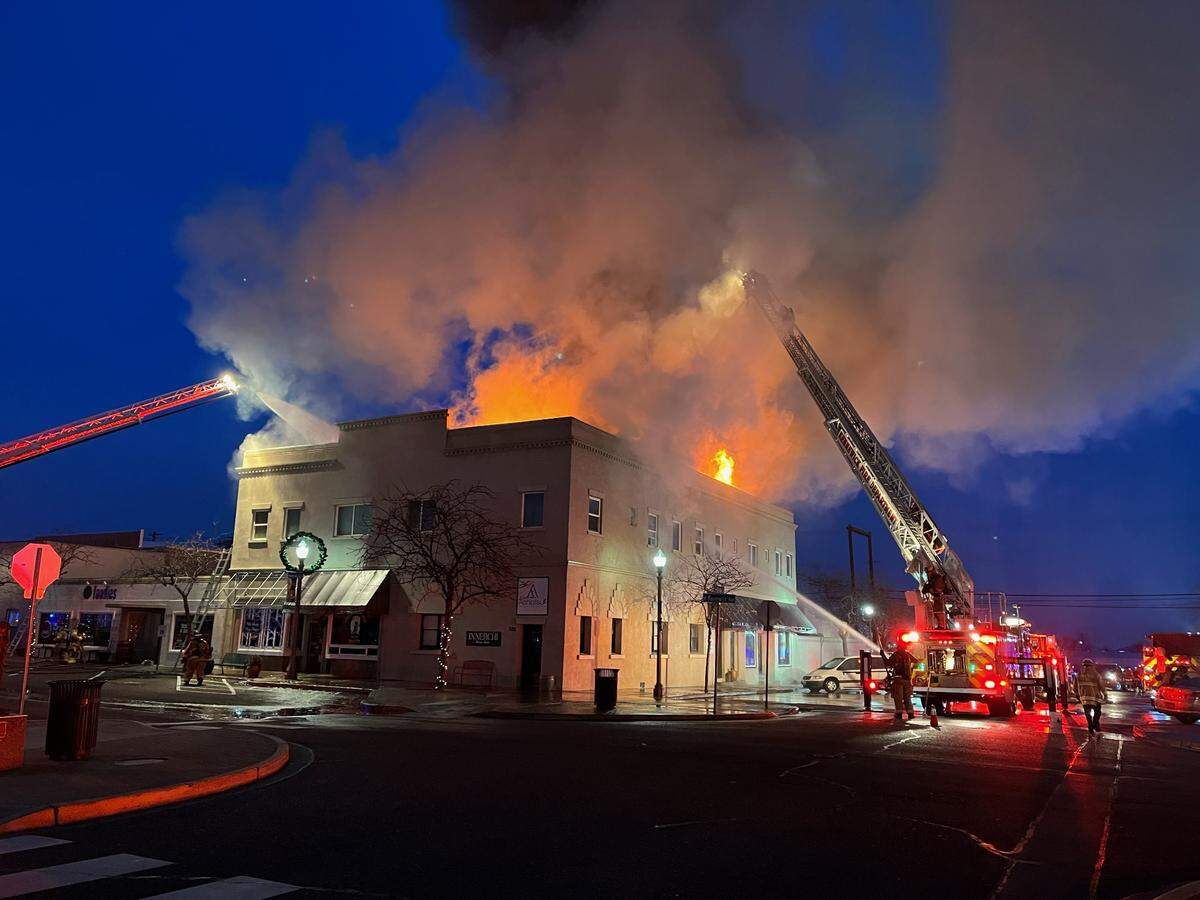 One person has been taken to the hospital after escaping a fire that engulfed a commercial building next to Foodies in downtown Kennewick early Friday morning. The call for the two alarm fire came in around 5:30 a.m. alerting authorities to the blaze near the corner of North Cascade Street and West Kennewick Avenue.