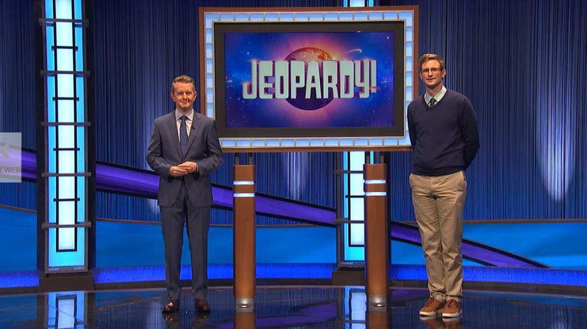 Jeopardy! host Ken Jennings, left, stands next to contestant David Sibley, a Walla Walla Episcopal priest.