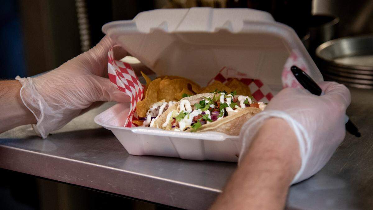 General manager Tony Angelo of Kennewick finishes up an order of fish tacos at Foodies Brick and Mortar in Kennewick.