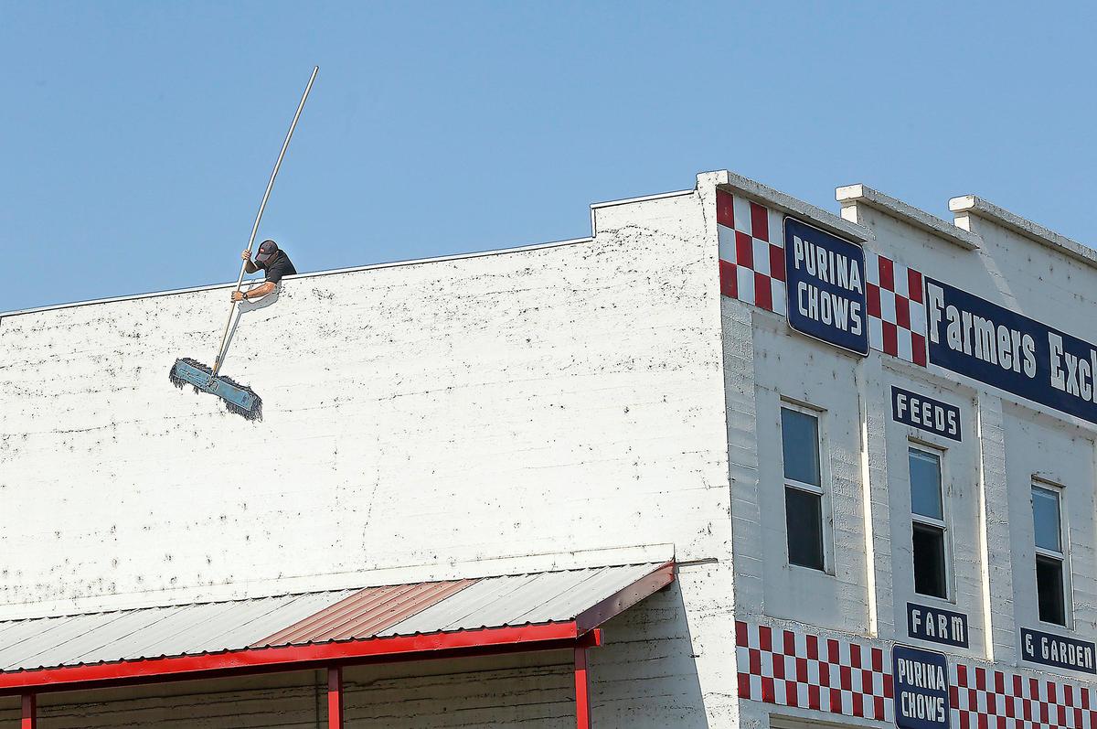 The historic Farmers Exchange building in downtown Kennewick was first painted with the red and white checkerboard pattern of Purina, one of the major brands it carried, in the 1970s.