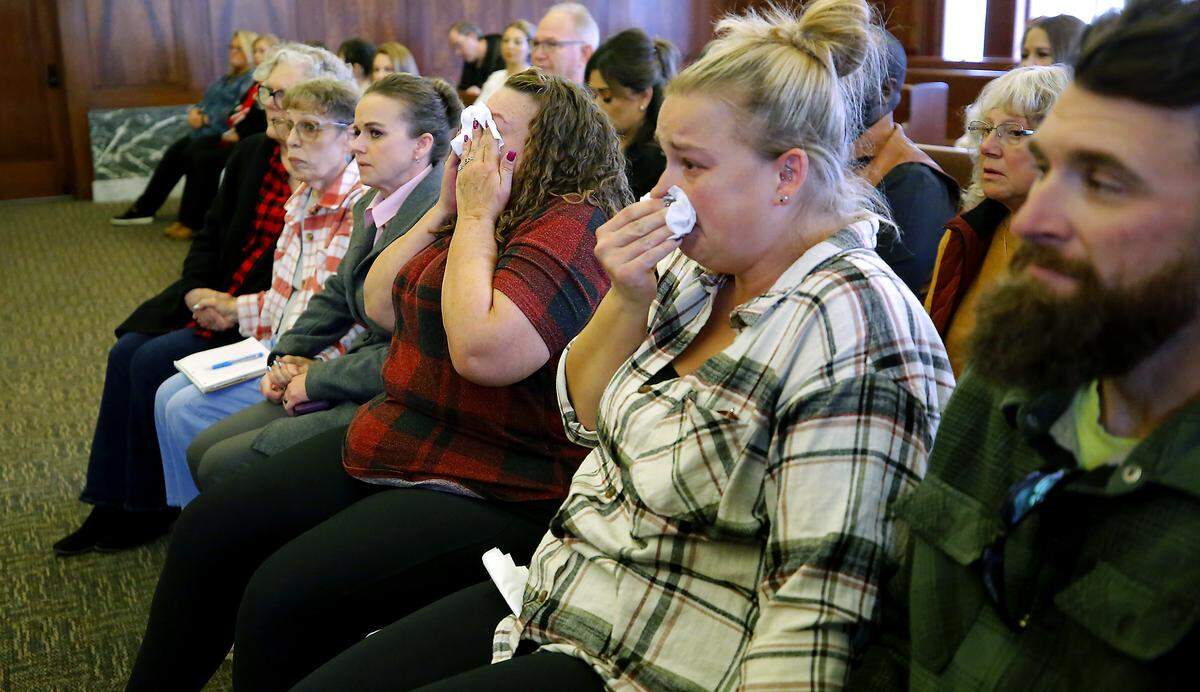 Murder victim family members of Richard Lenhart, friends and a Pasco police detective watch and react as a guilty verdict is returned by a jury in the murder trial of Joshua D. Davis in Pasco.