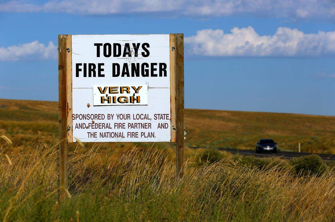 A sign on Highway 397 near Owens Road in rural Benton County warns residents of the very high fire danger around the Mid-Columbia Basin. The National Weather Service issued a red flag warning.