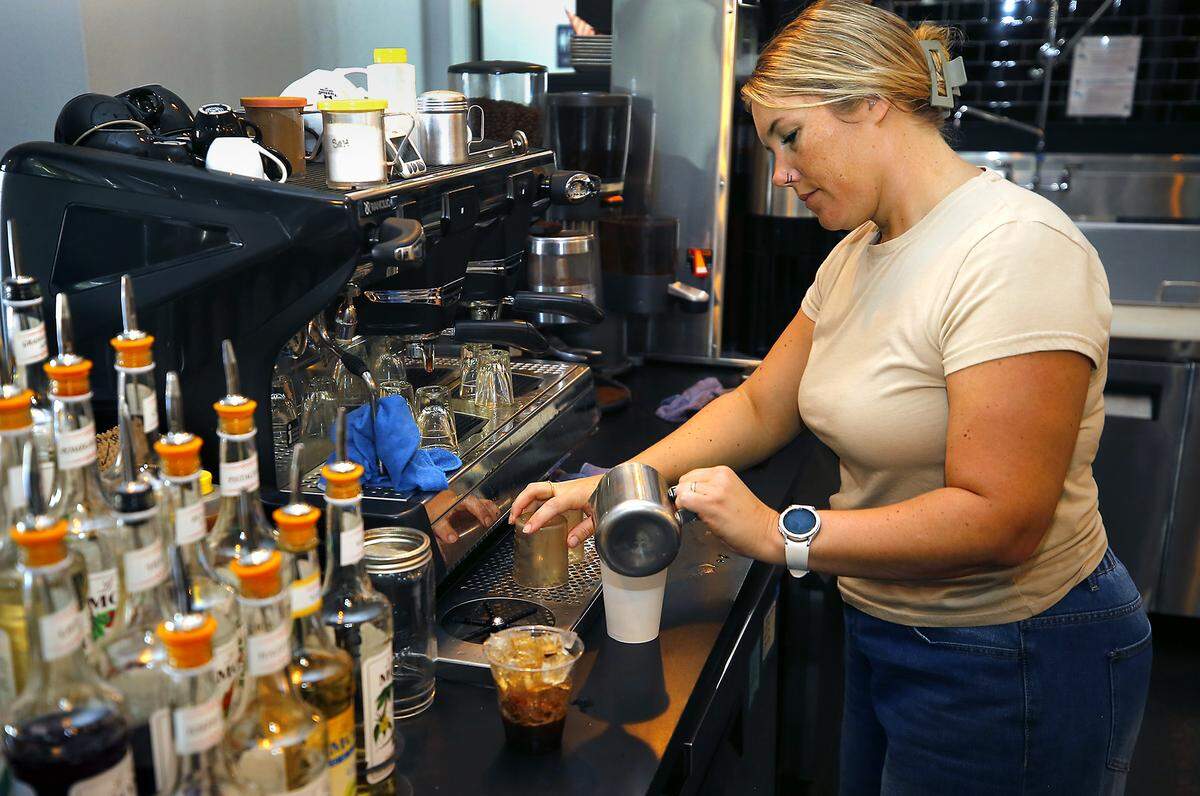 Manager Tawnee Gutzmer makes a coffee drink at recently at Rockabilly Roasting Co. is at 101 W. Kennewick Ave.