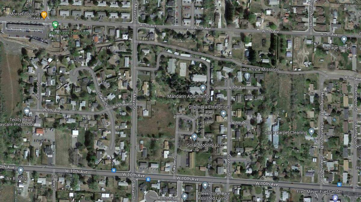 Kennewick police surrounded an apartment after the occupant allegedly pointed a gun at an officer during a chase.