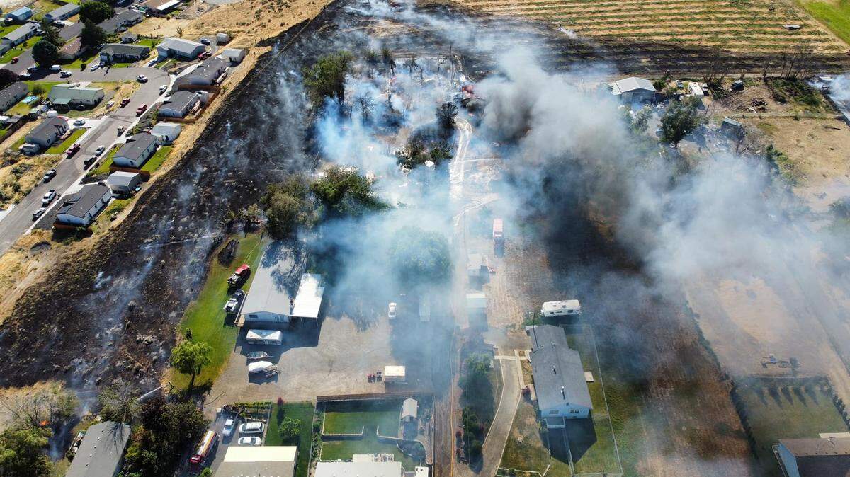A fire burned through brush and farm land on 13th Street in Benton City on Tuesday.