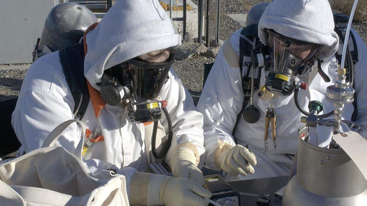 Hanford workers take a sample of the vapors in the head space of one of Hanford’s underground tanks holding high level radioactive waste.
