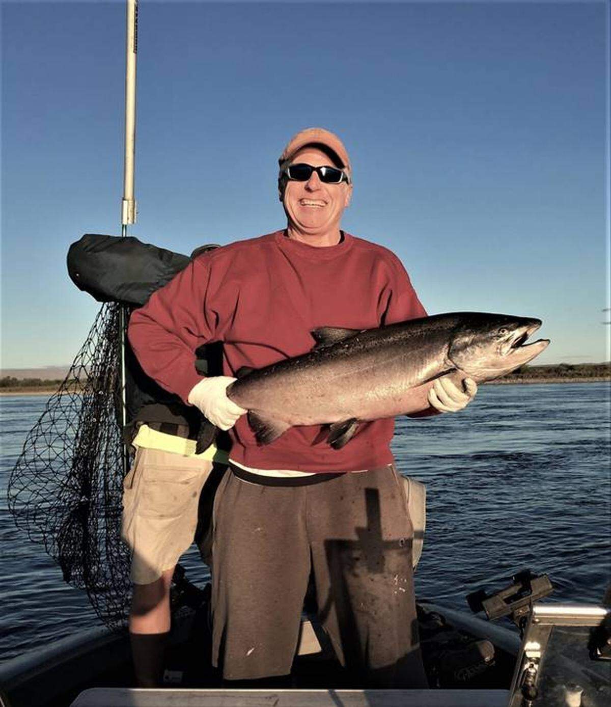 Richland’s Jim Klos shows off a 20-pound king salmon caught on the Columbia River on Sept. 13 in Richland.