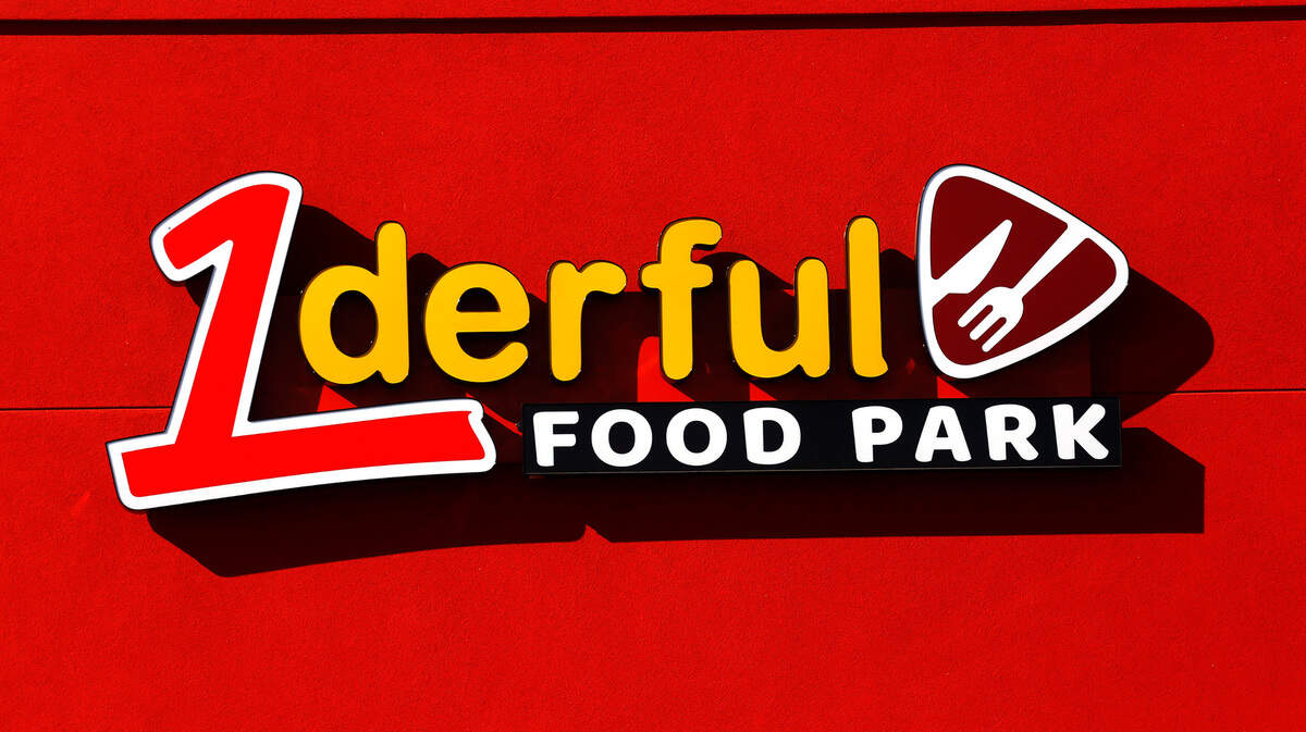 Signs have been installed on a new food park that will feature walk-up order windows for seven restaurant kitchens.