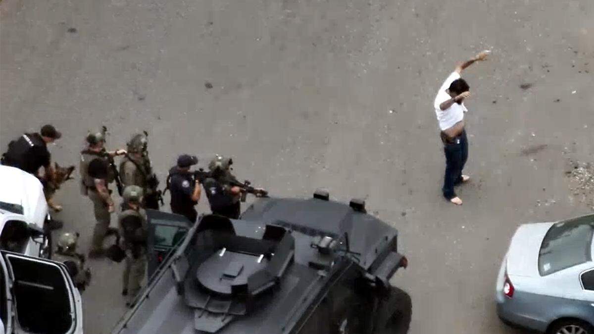 The Tri-Cities Regional SWAT team and Kennewick and Richland officers arrested robbery suspects Mark Barnett and Matthew Miller after searching an apartment in Kennewick and a Richland home.