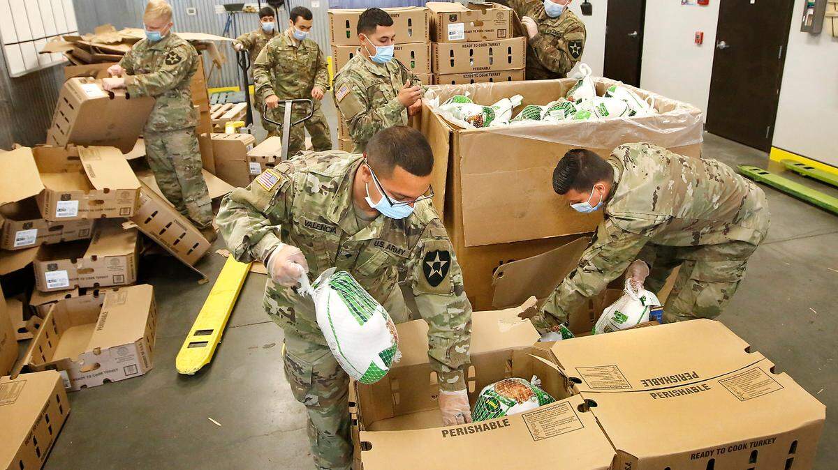 National Guard members helped last year move frozen turkeys to large bins at the Second Harvest facility in Pasco.