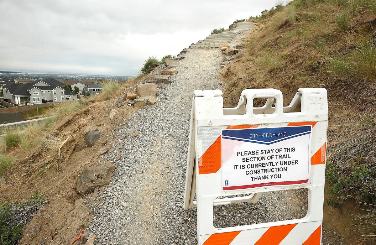 A sign on the Badger Mountain Canyon Trail warns hikers Friday the popular hiking trail is still closed for a construction project to replace stairs near Trailhead Park in south Richland. The city of Richland closed the trail on April 25 for the project which was originally expected to last 3 to 4 weeks. Trail users can still hike the 1,579-foot mountain using the Bypass Trail.