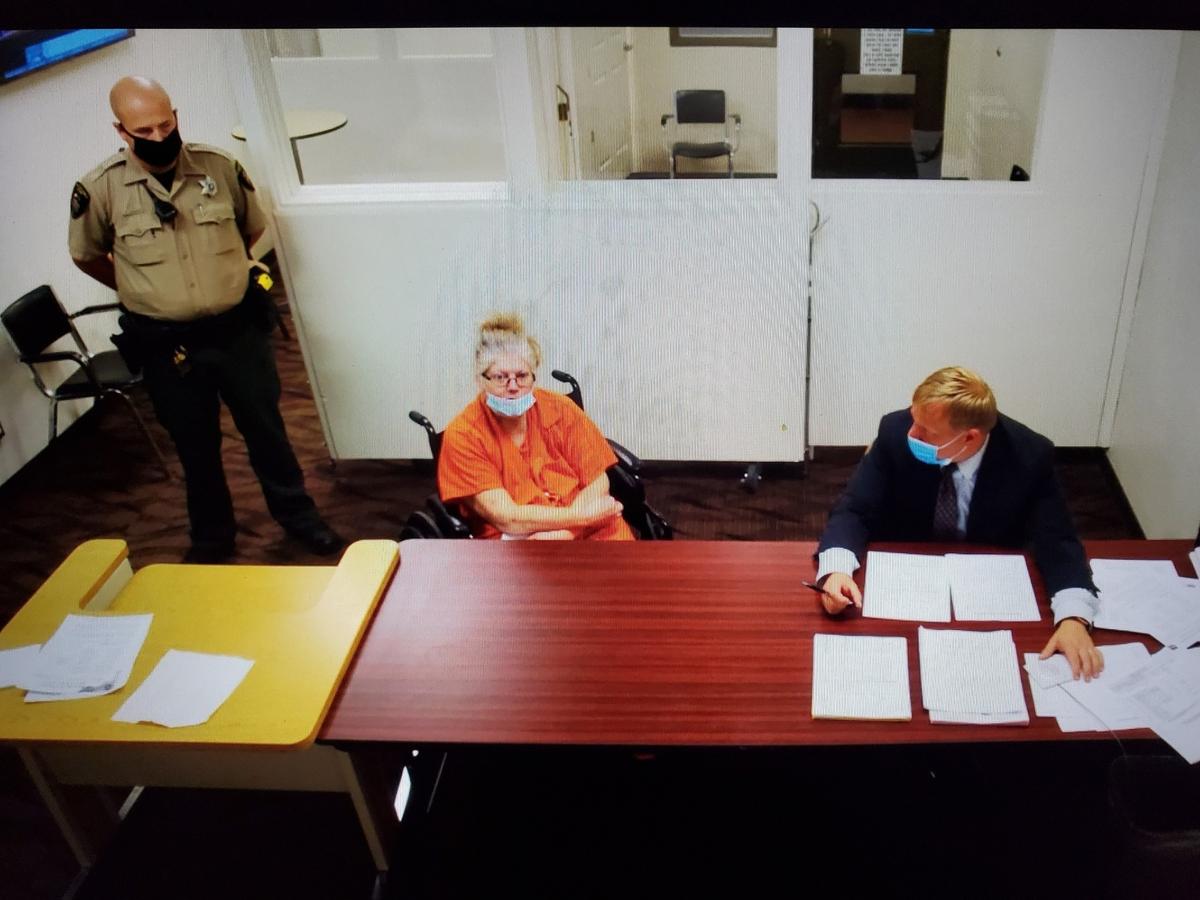 Marta M. Miller, seated in the wheelchair, made her first appearance in Franklin County Superior Court in the stabbing of a Pasco man.