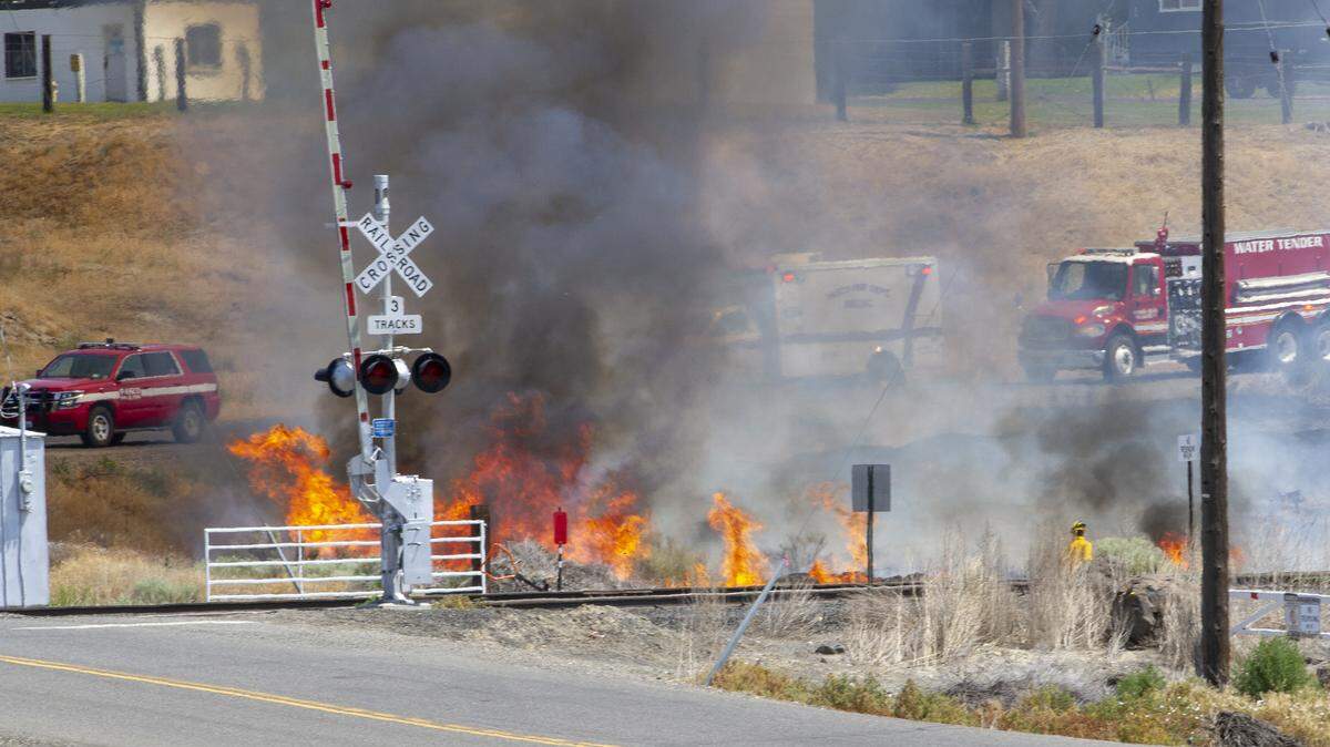 The Pasco Fire Department and Franklin County Fire District 3 work to contain the blaze that is burning heavy sagebrush. The fire started last night, and rekindled this morning.