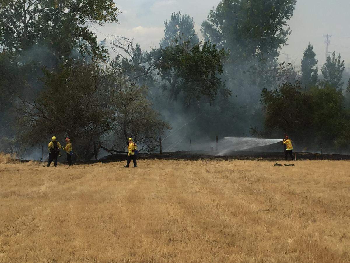 A two-alarm wildfire threatened homes on the edge of Zintel Canyon Thursday afternoon.