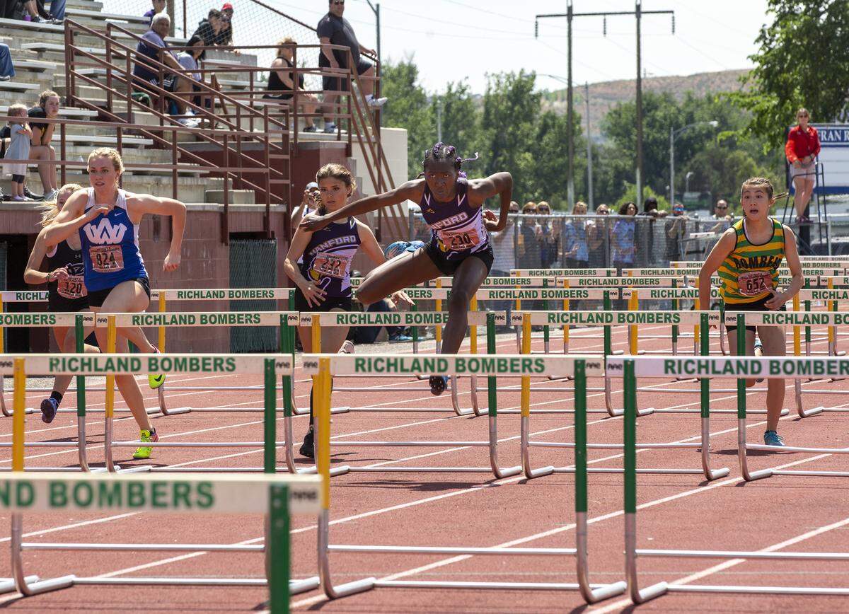 Hanford’s Nyenuchi Okengbo competes in the District 8 3A/4A Track and Field Championship last weekend at Fran Rish Stadium in Richland. She’s the third-fastest 300 hurdler in the state.
