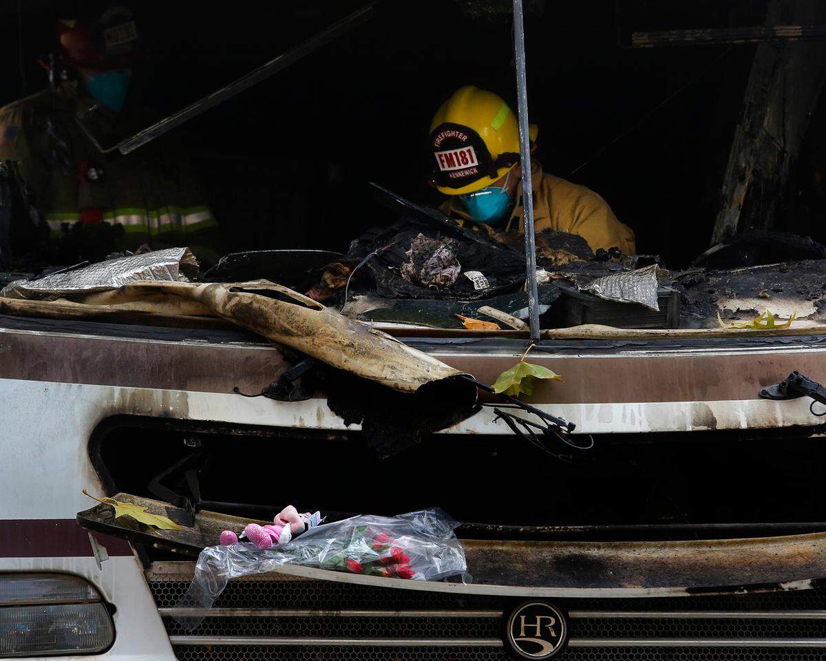 Kennewick fire investigators search Monday for clues to the cause of Saturday’s fatal RV fire.